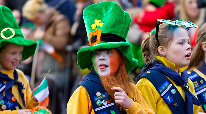 Children in Irish hat participate in a parade for St. Patrick's Day