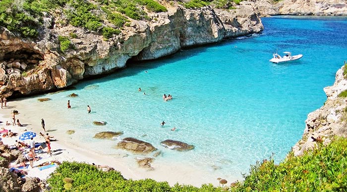 People sunbathing at the beach of Majorca