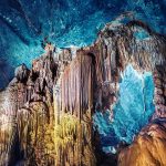 Artificially highlighted limestone formations in the cave named Paradise