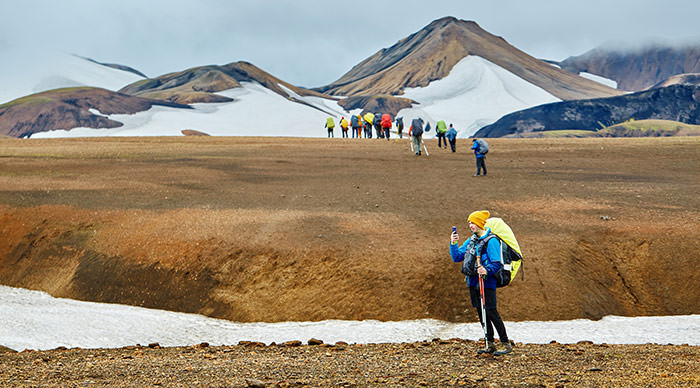 Hikers on the trail to the National Park of Landmannalaugar Iceland