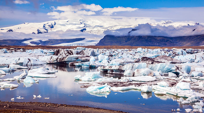 White-blue ice is piled up in turquoise water of Jokulsarlon Lagoon